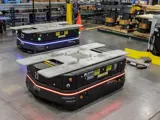 Automated guided vehicles moving across the factory floor