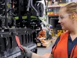 Employee inspecting a BEV assembly